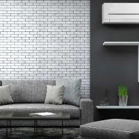 Salon design aux tons gris avec climatiseur blanc